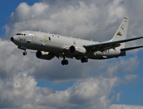 maritime patrol aircraft in front of clouds
