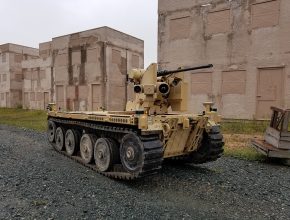 tracked unmanned vehicle with a mounted machine gun and sensors
