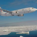 rendering of a maritime patrol aircraft flying over frozen waters in the Arctic