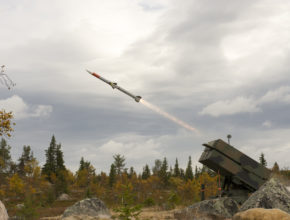 a missile is fired from a missile launcher near a forest