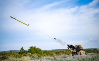a soldier fires a missile into the air from a handheld launcher