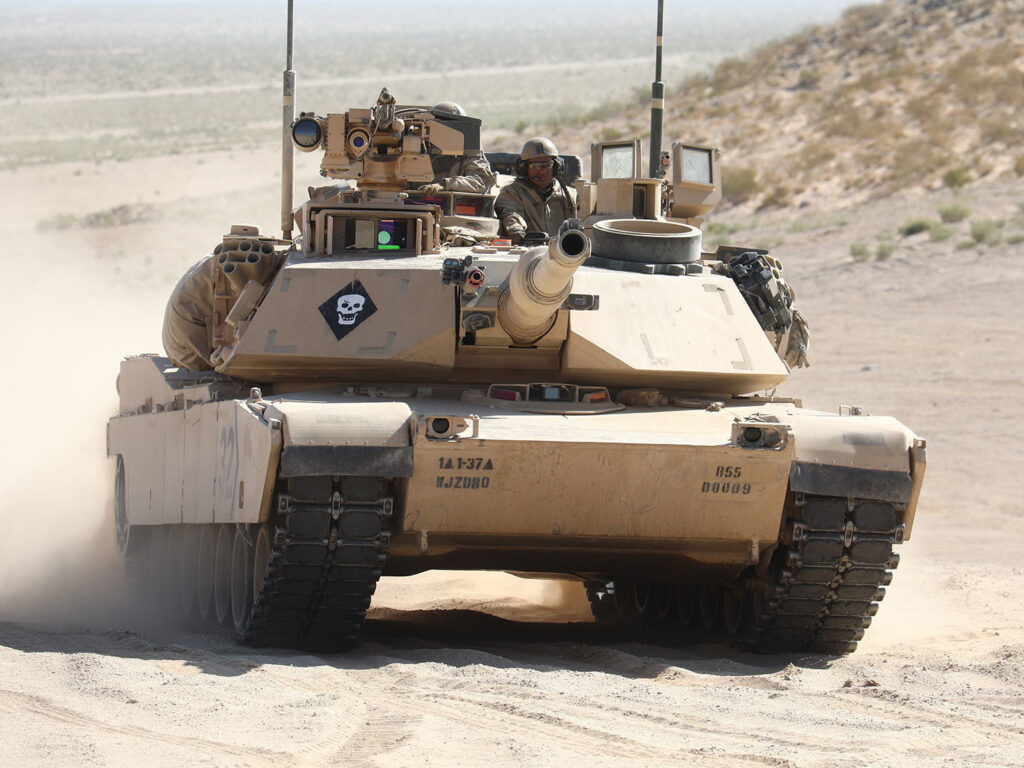 a tank drives through the desert