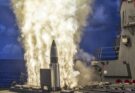Flames erupt from a ship-launched missile