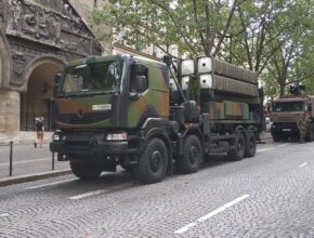 A mobile missile launcher sits on a city street