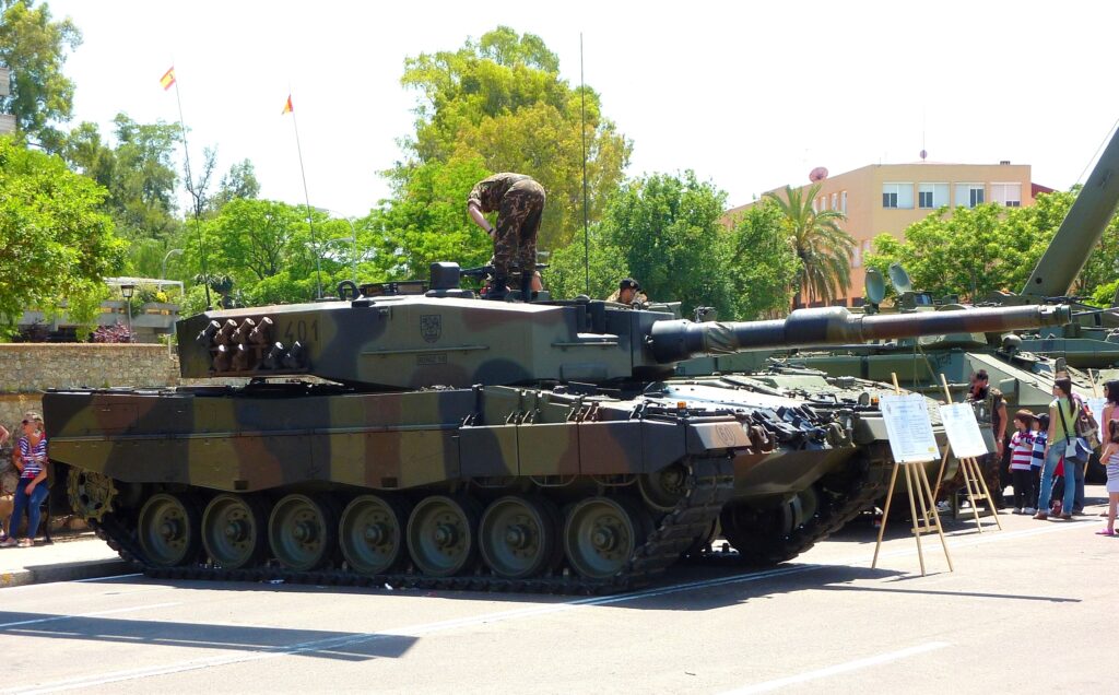 a camouflage tank sits on display 