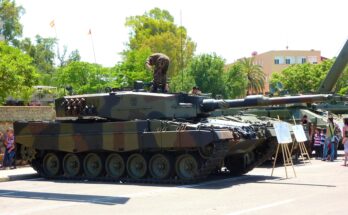 a camouflage tank sits on display