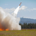 A launcher shrouded in smoke during a missile launch