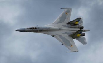 a fighter jet flies through the sky