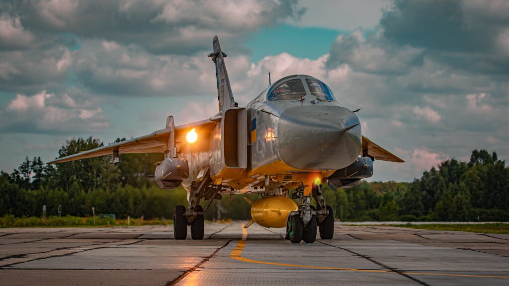 a fighter jet taxis on a runway 