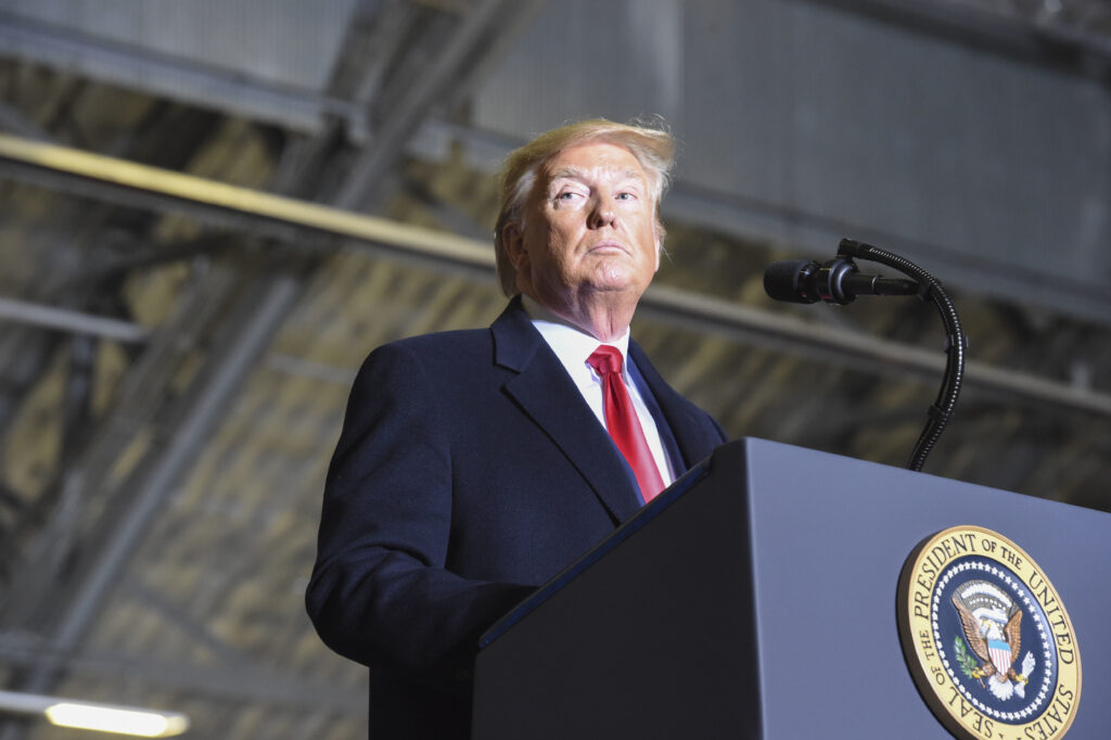 the president delivers a speech at a podium