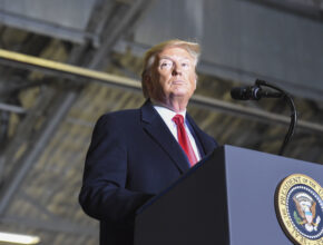 the president delivers a speech at a podium