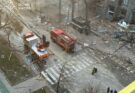 emergency vehicles parked near city rubble