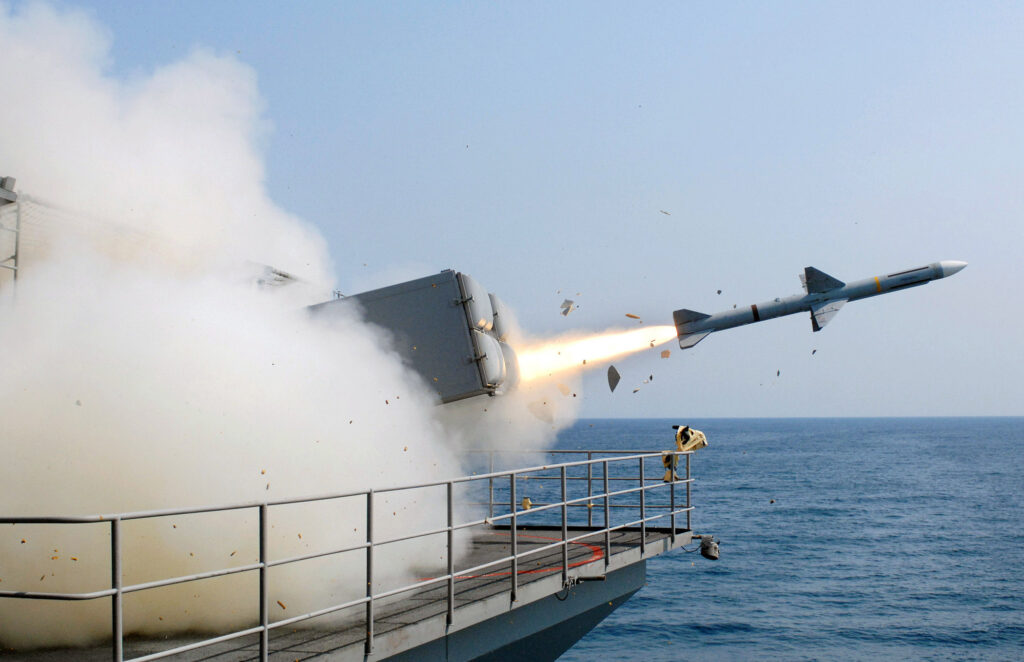 a missile launched from a ship creates a cloud of smoke