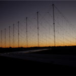 a defense radar array is at dusk