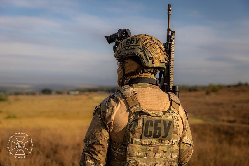 A soldier stands in a field