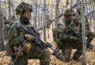 Camouflaged soldiers in a forest