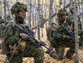 Camouflaged soldiers in a forest