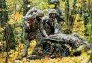 Ukrainian soldiers use a robotic vehicle in a forest