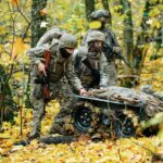 Ukrainian soldiers use a robotic vehicle in a forest