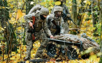 Ukrainian soldiers use a robotic vehicle in a forest