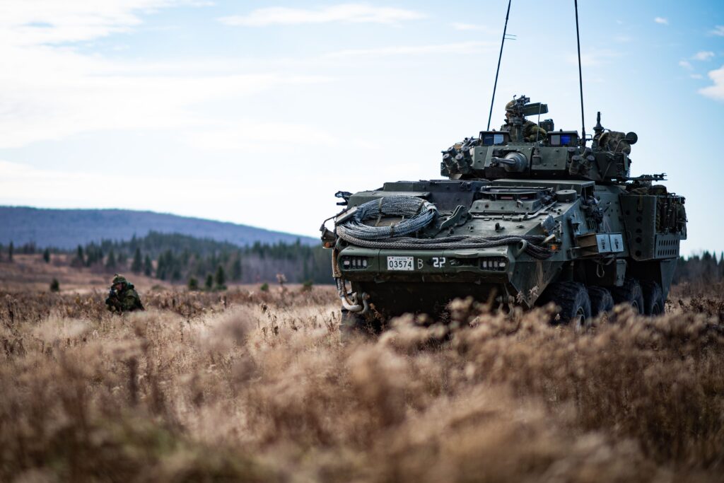 A Canadian armored vehicle positioned in a field
