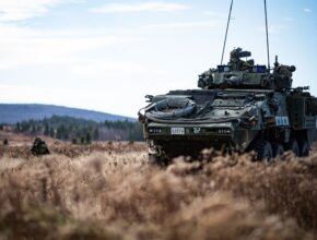 A Canadian armored vehicle positioned in a field