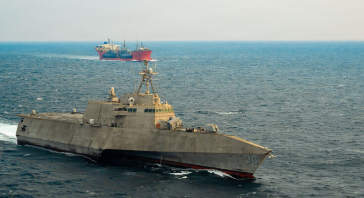 USS Canberra (LCS 30) escorts merchant vessel Seaway Hawk transporting four decommissioned Avenger-class Mine Countermeasures Ships