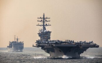 U.S. Navy warships transit the Strait of Hormuz