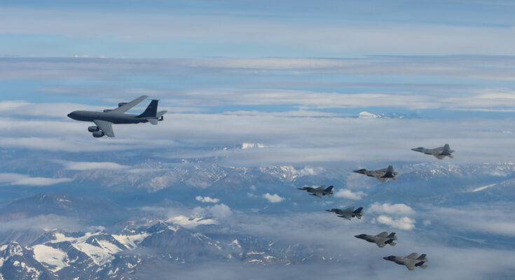 U.S. Air Force F-35A Lightning IIs, F-16 Fighting Falcons, F-22A Raptors and a KC-135 Stratotanker conduct sorties over the Joint Pacific Alaska Range Complex near Eielson Air Force Base, Alaska.